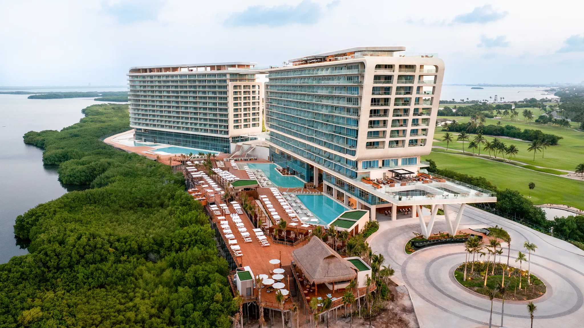 8 of the Best All-Inclusive Resorts in Cancún (Bookable With Points) 9 Hyatt Viva Grand Island hotel aerial view two hotel towers and several pools.
