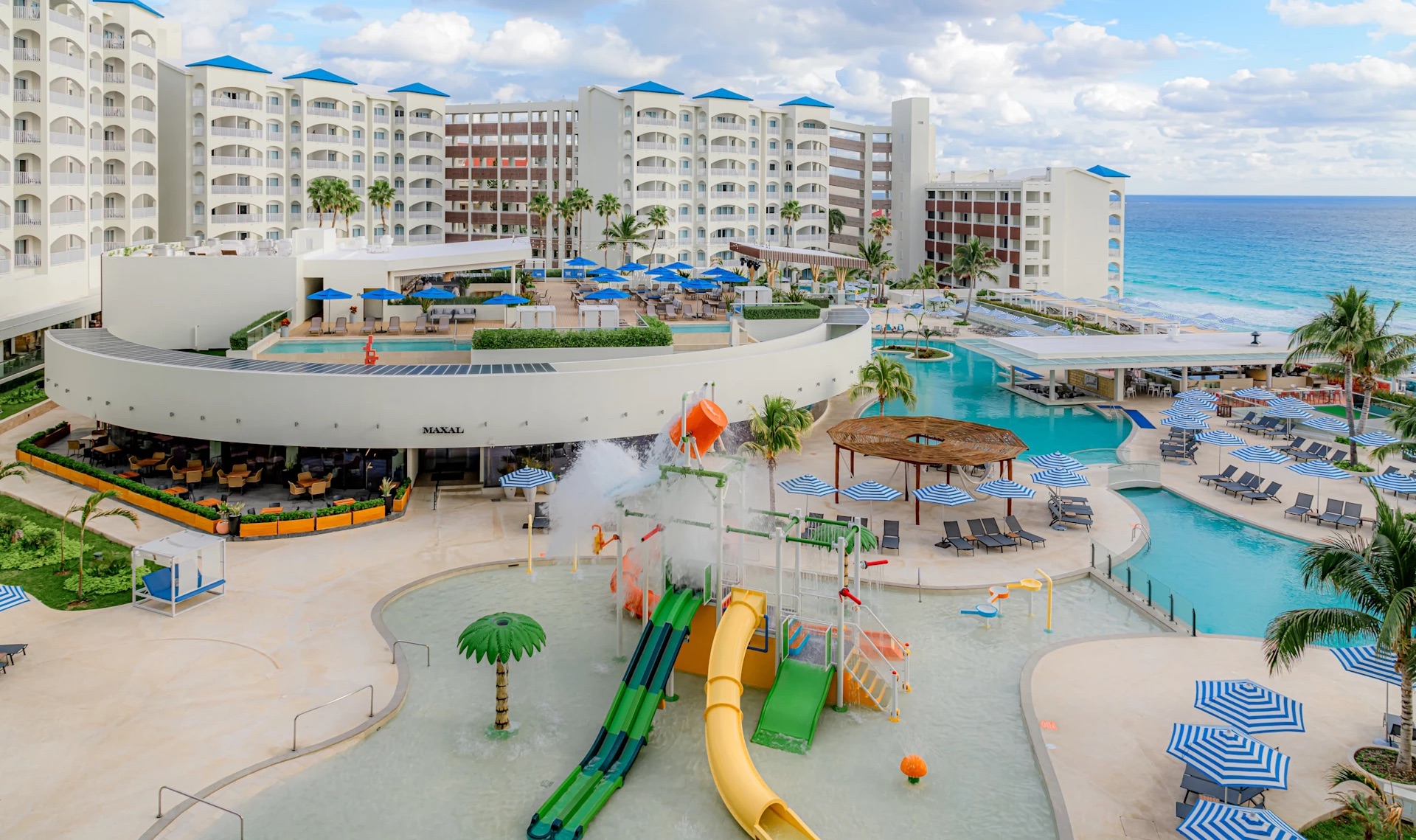 8 of the Best All-Inclusive Resorts in Cancún (Bookable With Points) 16 Hilton Mar Caribe aerial view with waterpark in the center of the resort for kids