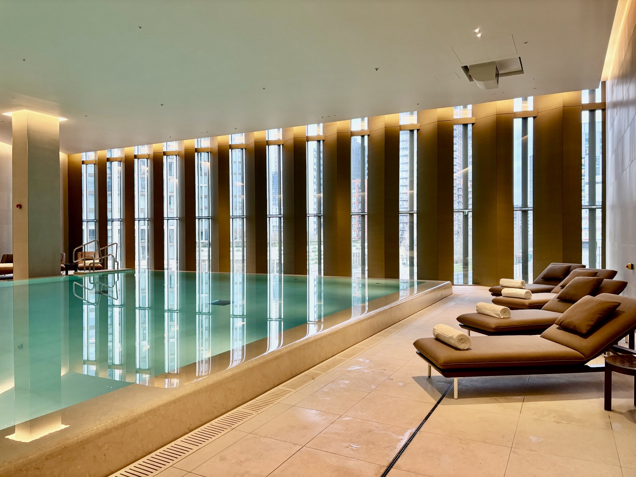 Inside the Park Hyatt London River Thames: Rooms, Dining, Pool & More 51 Pool with floor-to-ceiling windows and lounge chairs