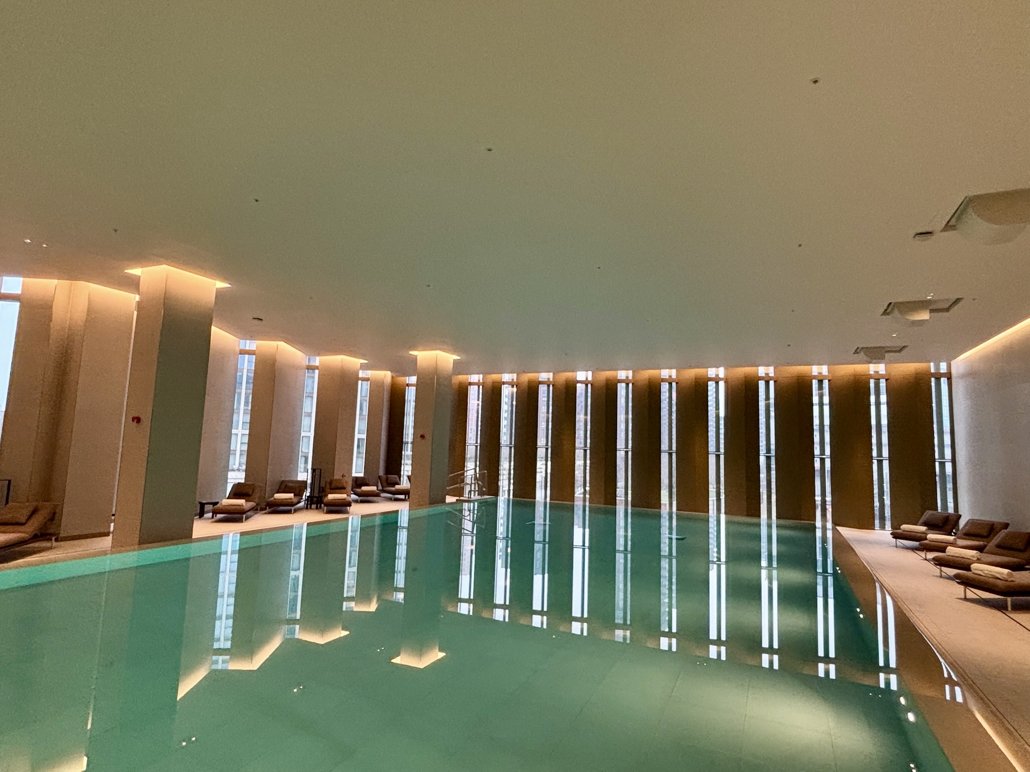 Inside the Park Hyatt London River Thames: Rooms, Dining, Pool & More 52 Pool with floor-to-ceiling windows and lounge chairs