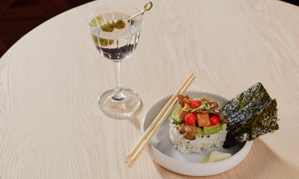 After a 3-Year Wait, Capital One’s 'Flagship' Landing Is Ready to Open at LGA 3 coconut mango sticky rice and a martini on a table