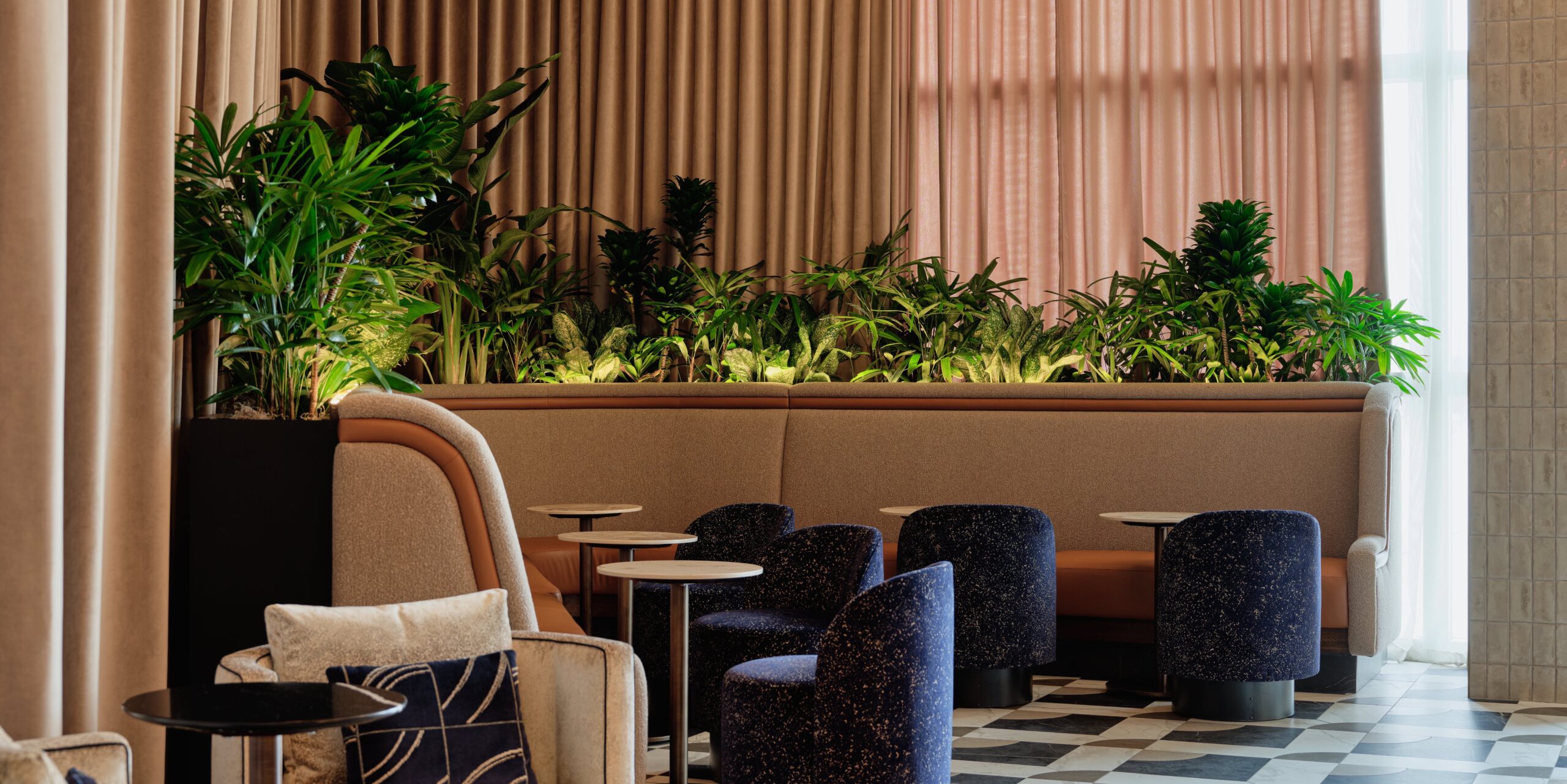 Amex Opens New ‘Sidecar' Lounge Concept at LAS ... & It’s Tiny 2 Sidecar by Centurion Lounge seating area with greenery