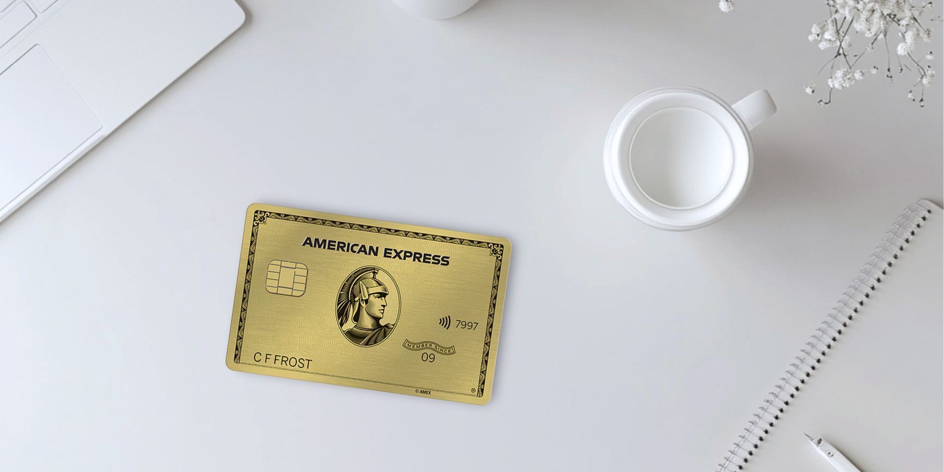 Amex Gold Card with laptop, coffee cup, and flowers