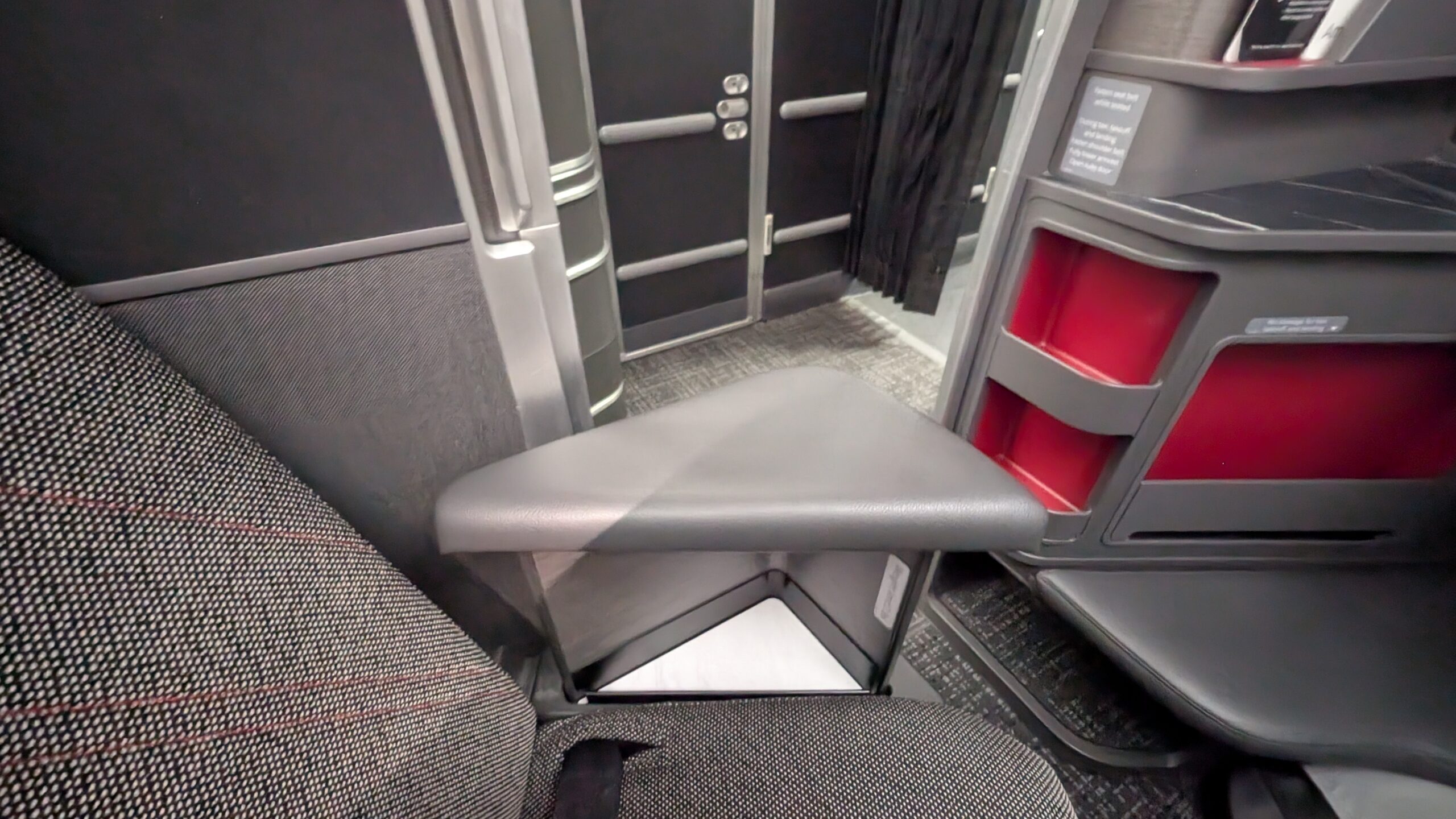American Airlines' New Flagship Suite Review: A Stellar Hop Across the Pond 33 Armrest and storage compartments