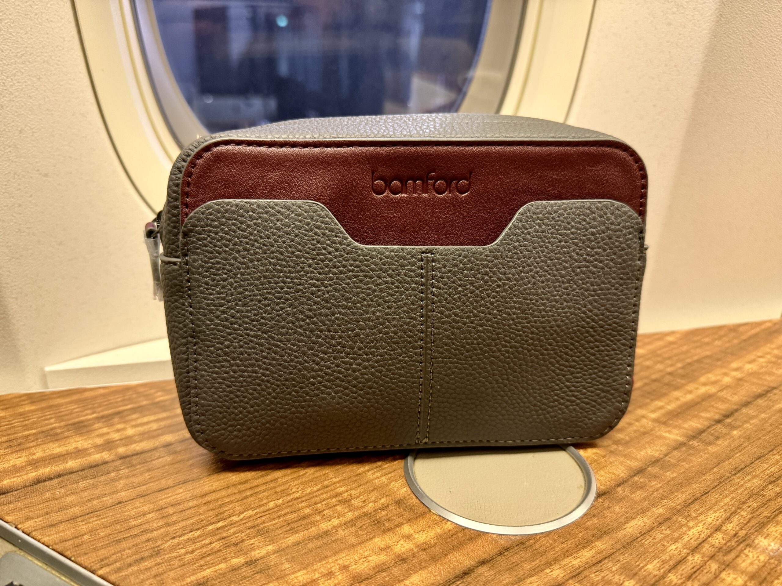 Aging Like a Fine Wine: Cathay Pacific First Class 777 Review 24 leather bag with the word bamford on it