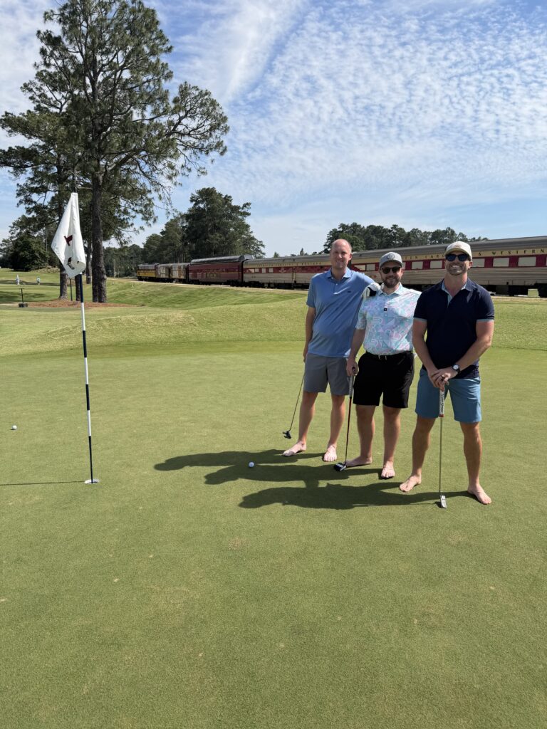 7 Money-Saving Tips for a Pinehurst Golf Trip 5 3 men standing on a golf green barefoot posing for a picture
