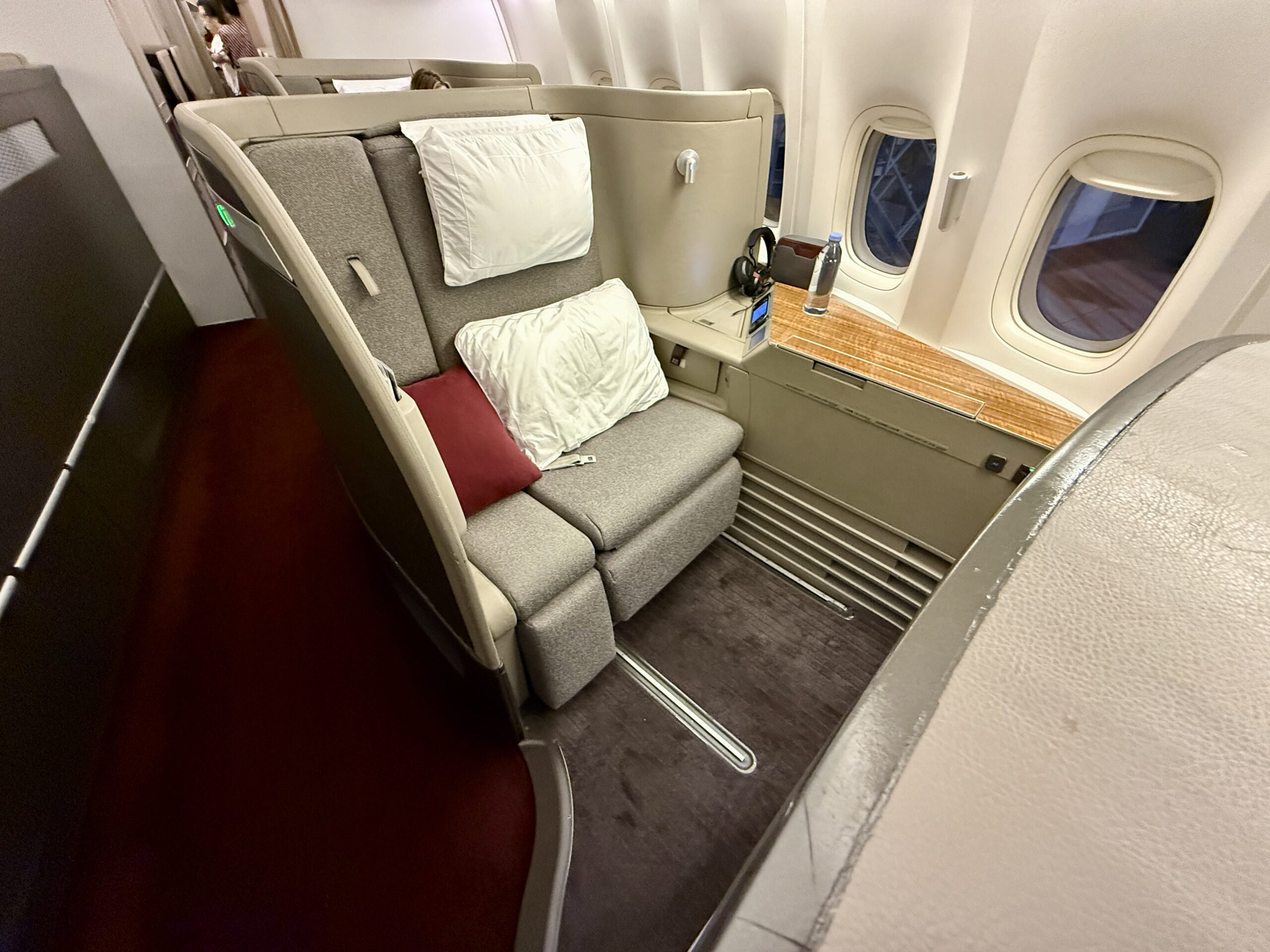 Aging Like a Fine Wine: Cathay Pacific First Class 777 Review 12 open cathay pacific first seat with pillows