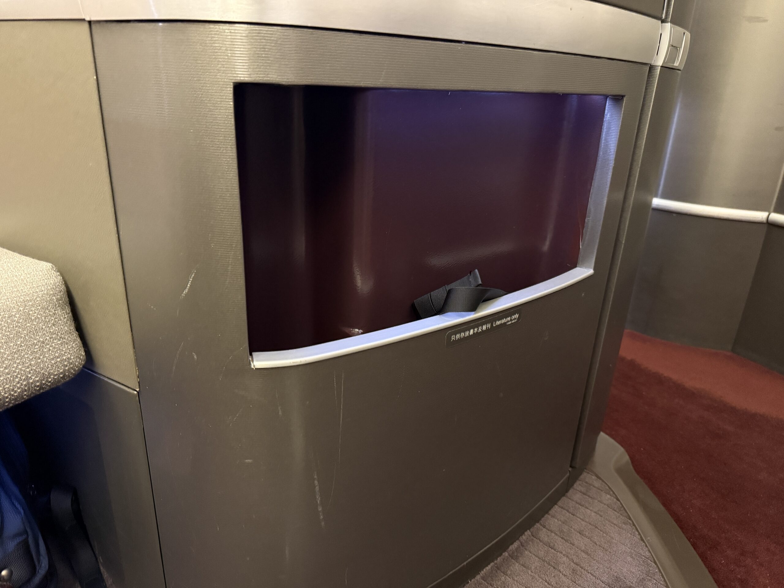 Aging Like a Fine Wine: Cathay Pacific First Class 777 Review 20 large open storage compartment in first class seat