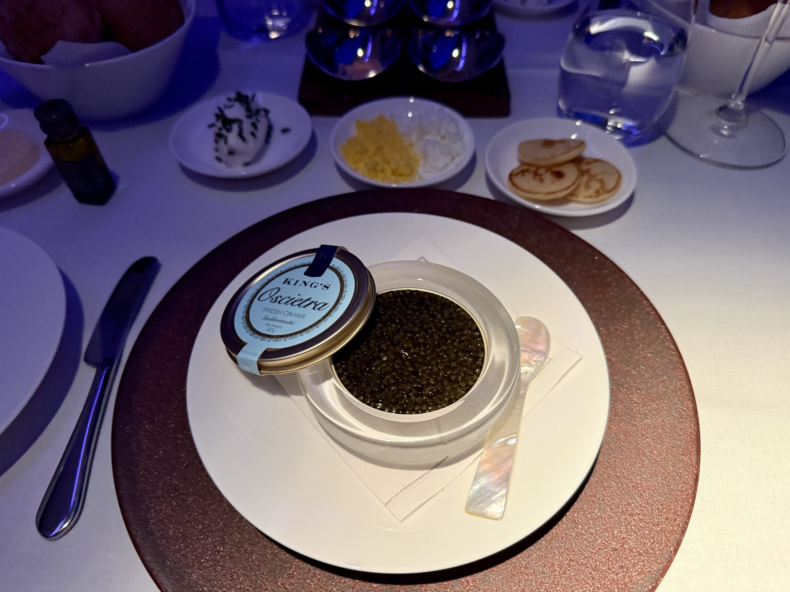 Aging Like a Fine Wine: Cathay Pacific First Class 777 Review 32 tin of caviar on a plate surrounded by accompaniments