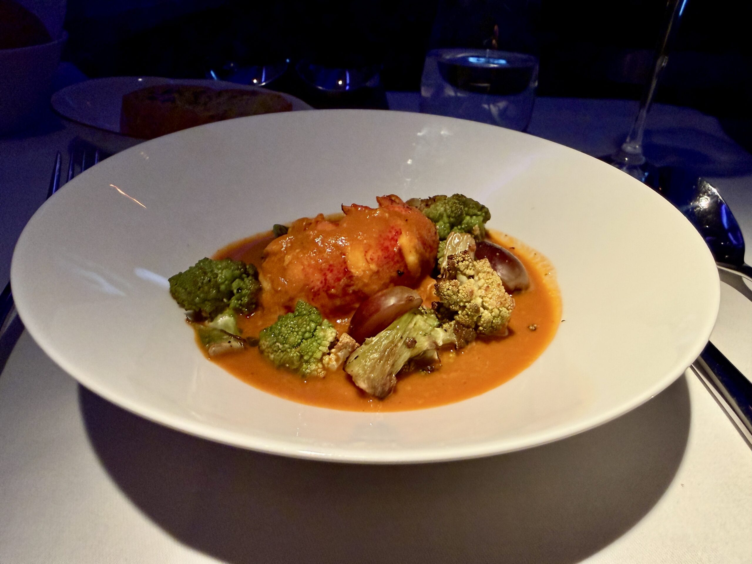 Aging Like a Fine Wine: Cathay Pacific First Class 777 Review 36 lobster tail with broccoli and grapes in red sauce