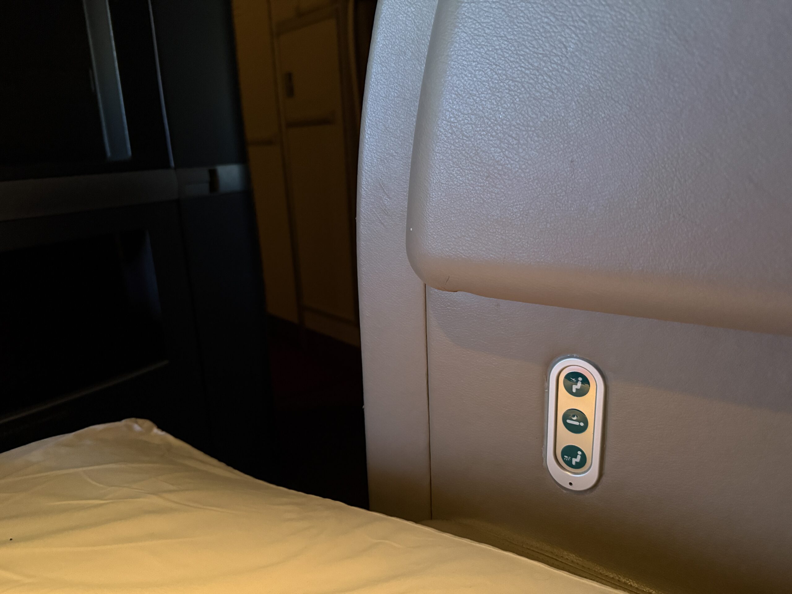 Aging Like a Fine Wine: Cathay Pacific First Class 777 Review 23 three buttons built into a large panel