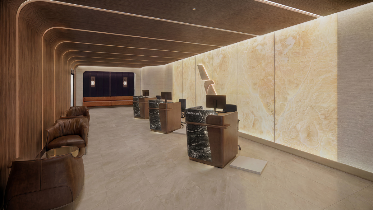 American Goes Premium, Announcing New 'Flagship' Check-In and Massive Lounge in Dallas 1 A rendering of AA's new Flagship check-in desks at DFW, with three seperate podiums and individual leather chairs.