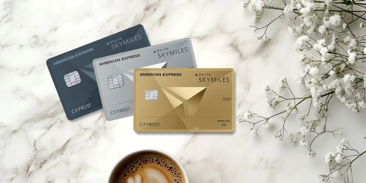 The Extra Mile, July 15: Pick Up the Phone to Book Business Class & More 3 three delta credit cards on a marble background with flowers