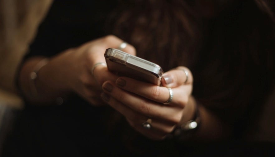The Extra Mile, July 15: Pick Up the Phone to Book Business Class & More 1 somebody holding a phone