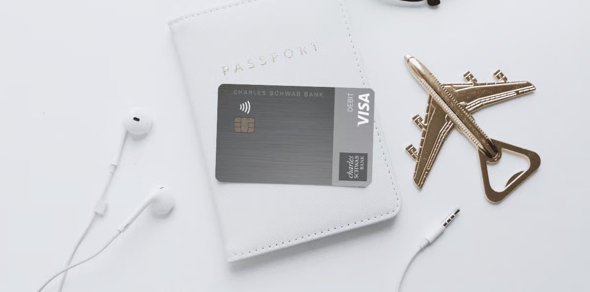 The Extra Mile, July 23: Our Bilt Palladium Report Card, Skipping the Currency Exchange Counter & More 5 Charles Schwab debit card with airplane bottle opener, headphones, and passport holder