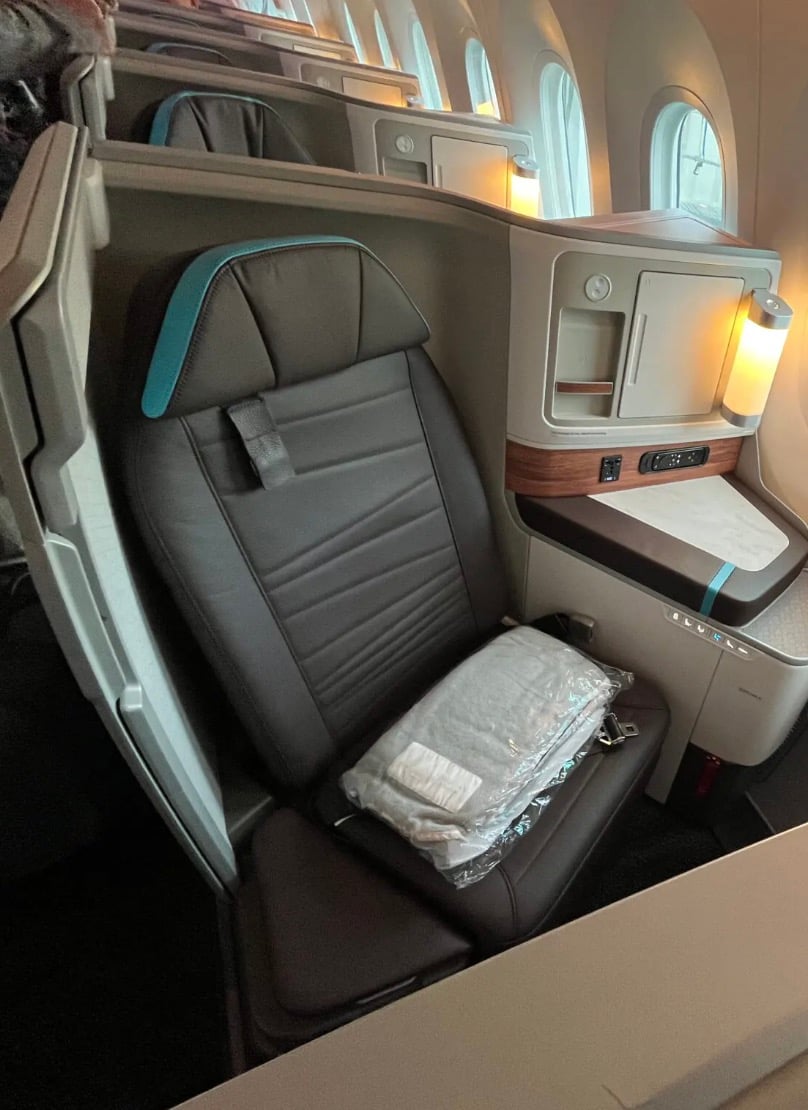 The Extra Mile, July 21: Delta’s Growing Grip on MSP, A First Class Deal to Hawaii & More 3 hawaiian airlines first class suite with light on and plane windows open