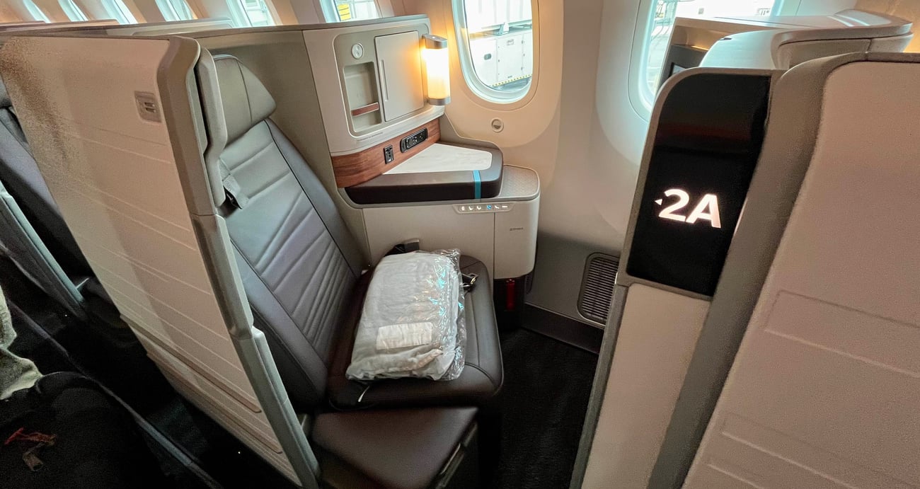 The Extra Mile, July 13: Delta Basic Biz Awards, The Best Hawaii Redemption & More 4 hawaiian airlines first class seat with lamp and blanket on seat