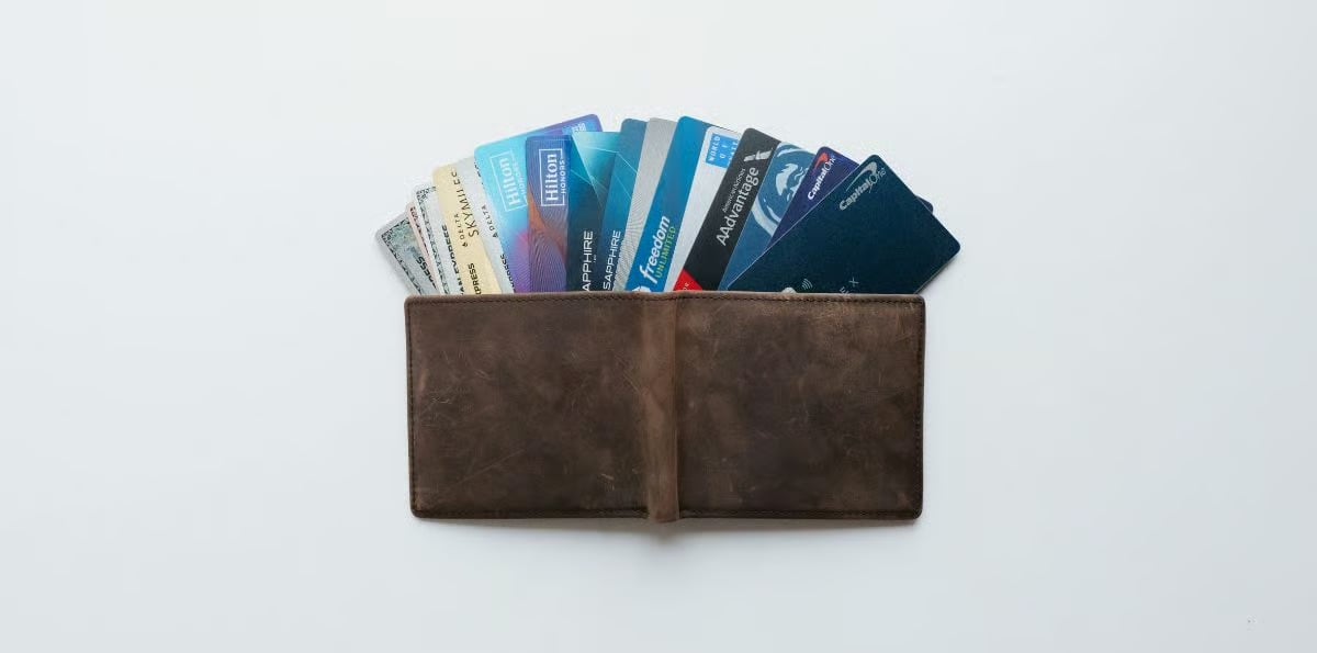 The Extra Mile, Sept. 24: Your Chase & Amex Credits Now Work at Costco & More! 1 an open wallet fanning out multiple credit cards