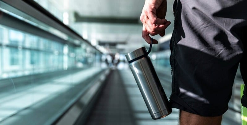 The Extra Mile, Sept. 10: Q&A with Flying Blue's New Boss, Aeroplan Card Changes & More 9 man holding watter bottle inside of airport
