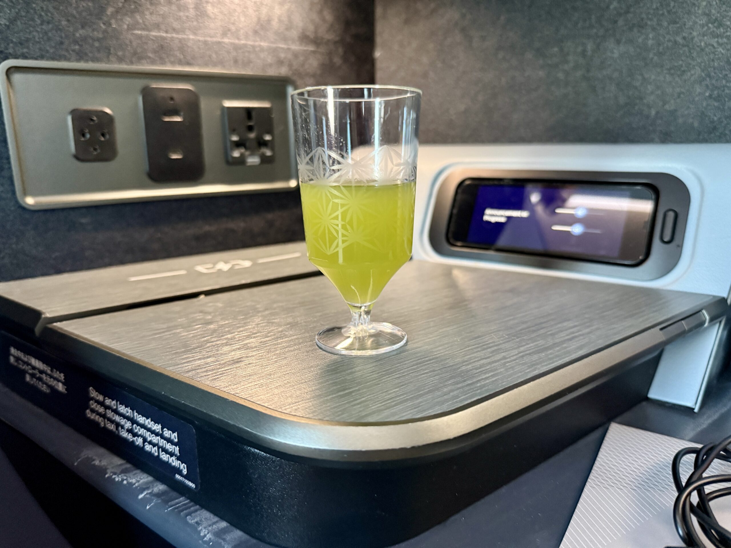 A 5-Star Flight to Tokyo: JAL's New A350 Business Class Suites 68 small glass of green juice in plastic cup