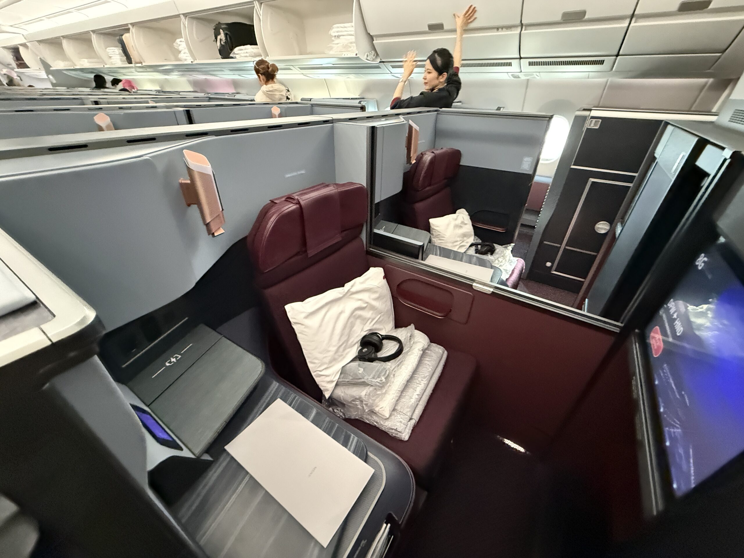 A 5-Star Flight to Tokyo: JAL's New A350 Business Class Suites 51 jal business class a350 center seats with flight attendant in background