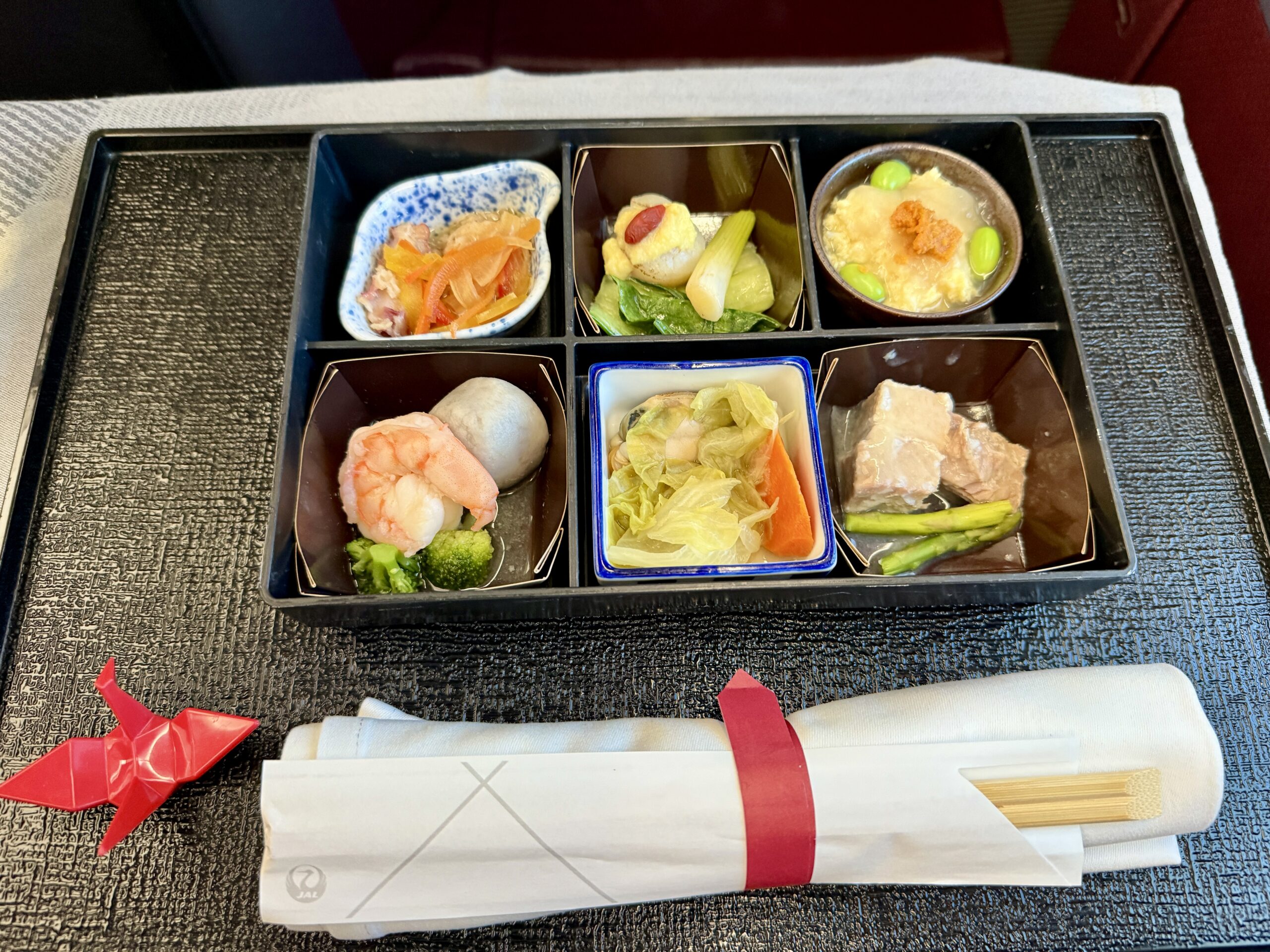 A 5-Star Flight to Tokyo: JAL's New A350 Business Class Suites 73 japanese meal with chopsticks on a black tray
