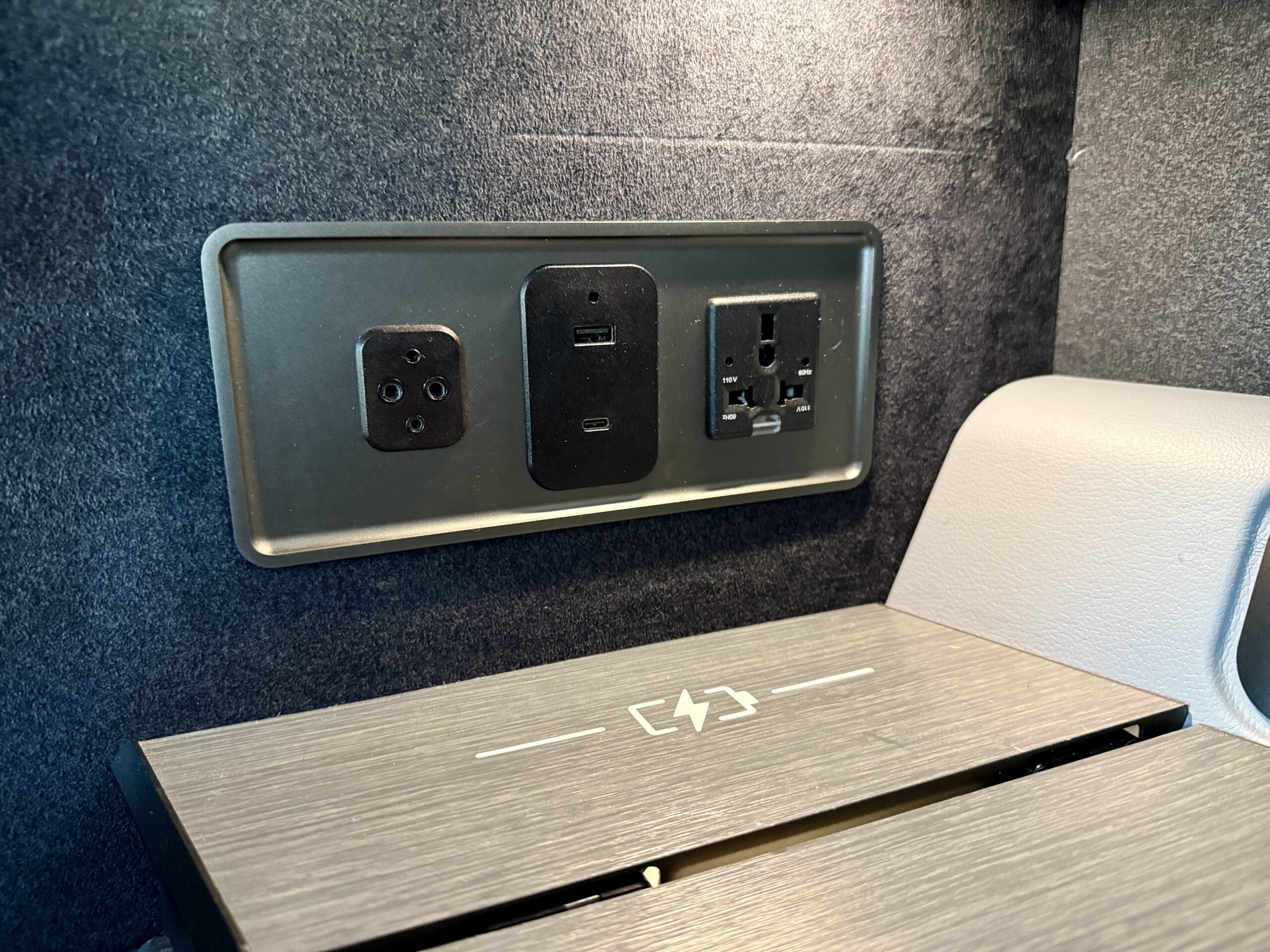 A 5-Star Flight to Tokyo: JAL's New A350 Business Class Suites 61 wall of power outlets and wireless charging pad
