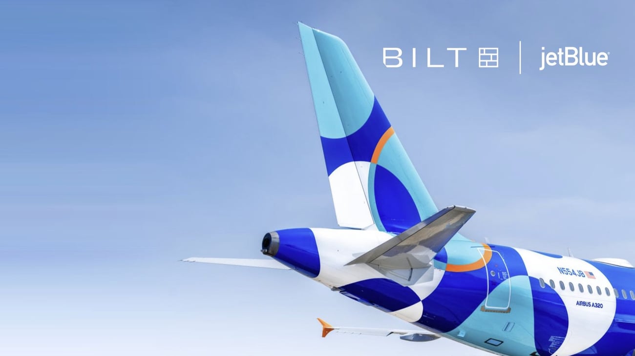 The Extra Mile, Oct. 20: New Alaska Routes, The Growing Basic Bait & Switch 7 JetBlue airplane tail and rear fuselage against a blue sky